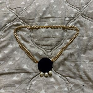 Elegant Pearl Necklace with Dark Pendant