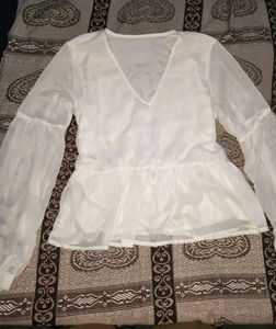 Sheer white peplum top with bell sleeves