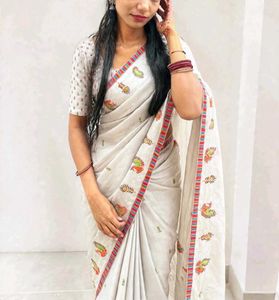 Elegant White Saree with Peacock Motifs