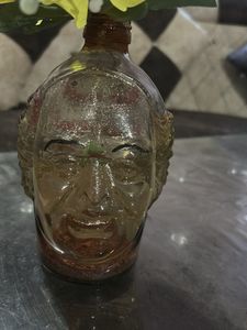 Unique Head-Shaped Vase with Yellow Flower