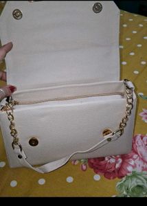 combo of suit and bag