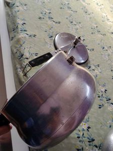 A silver pressure cooker