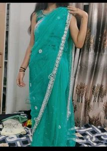 Stunning Teal Net Saree with Embellishments