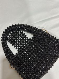 Hand made black pearls sling bag