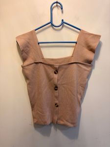 beige crop top with buttons