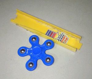 Blue Fidget Spinner And A Track Toy