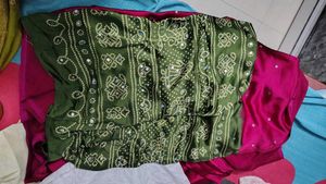 megenta Bandhani Saree with mehndi Border