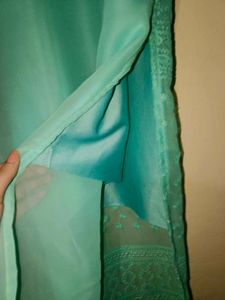 Elegant Teal Saree with Intricate Border