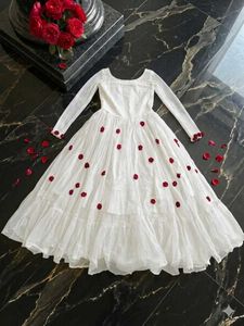 Elegant White Gown with Red Rose Embellishments