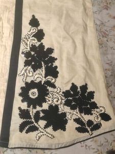 A contemporary short white kurta- no brand, worn o