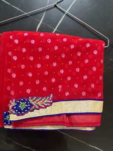 Vibrant Red Saree with Floral Embroidery