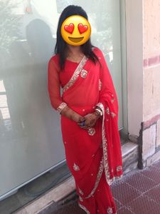 Vibrant Red Saree with Intricate Embellishments