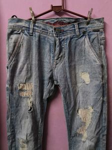 Distressed Light Wash Denim Jeans
