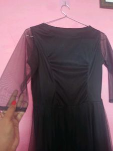 Elegant Black Dress with Sheer Sleeves