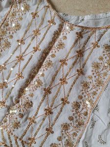 Elegant White Kurta with Embellished Neckline