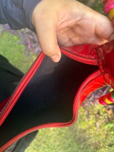 Shop Mistry Red Patent moon bag