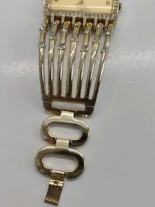 Elegant Gold Tone Watch with Rhinestones