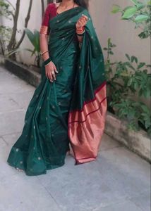 Elegant Green Saree with Red Border