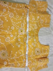 Yellow kurta with churidar and dupatta