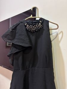 Chic Black Dress with Embellished Neckline