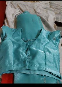 Elegant Teal Saree with Silver Embellishments