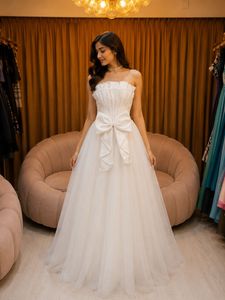 Elegant White Bridal Gown with Bow Detail