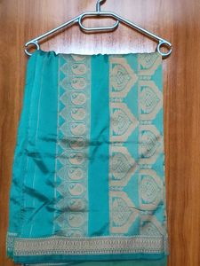 Elegant Green Silk Saree with Intricate Border