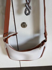 Chic White Hobo Bag with Brown Trim