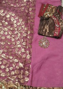 Elegant Pink Saree with Intricate Embellishments