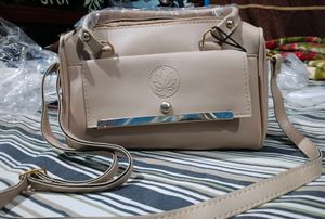 Chic Beige Handbag with Gold Accents