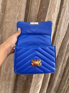 Blue sling purse