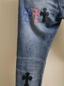 Chrome Hearts cross patch graphic blue jeans