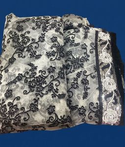 White net saree with black velvet design