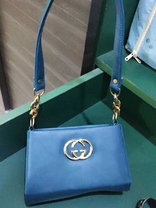 Stylish Blue Handbag with Gold Chain