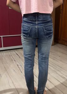 Distressed Blue Denim Jeans
