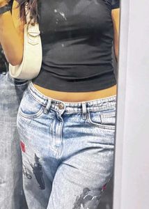Womens Blue Jeans and green fitted top