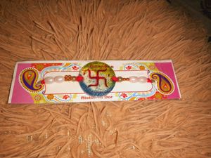 Resin Rakhi with Pearl Beads