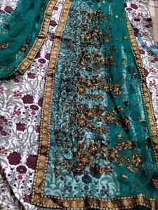 Embroidered green Saree with Golden Border
