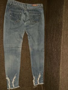 Distressed Blue Denim Jeans