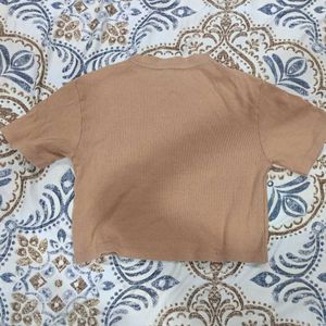 Tan crop top with rose Size M