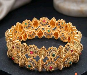 Elegant Gold Bangle with Stone Embellishments