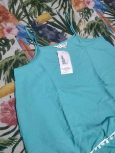 Chic Teal Top with Pom Po