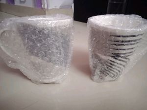 A PAIR OF MUGS WITH MOSAIC COLOUR EFFECT