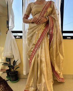 Elegant Golden Saree with Red Border