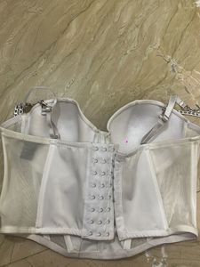 white corset top with silver chain detailing