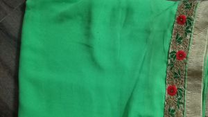 green colour saree with heavy cutwork border in pallu and golden work border all ever with stitched blouse