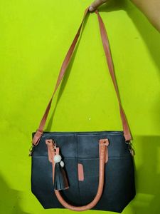 Chic Black Tote Bag with Tassel Accent