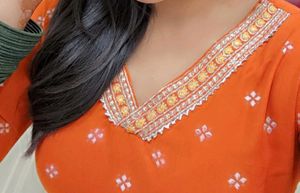 Elegant Orange Kurta Set with Intricate Embroidery