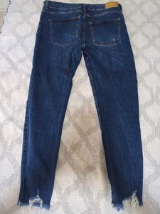 Ripped High-Waisted Blue Jeans