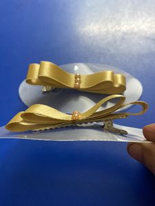 Ribbon How Hair Clip In Golden Colour